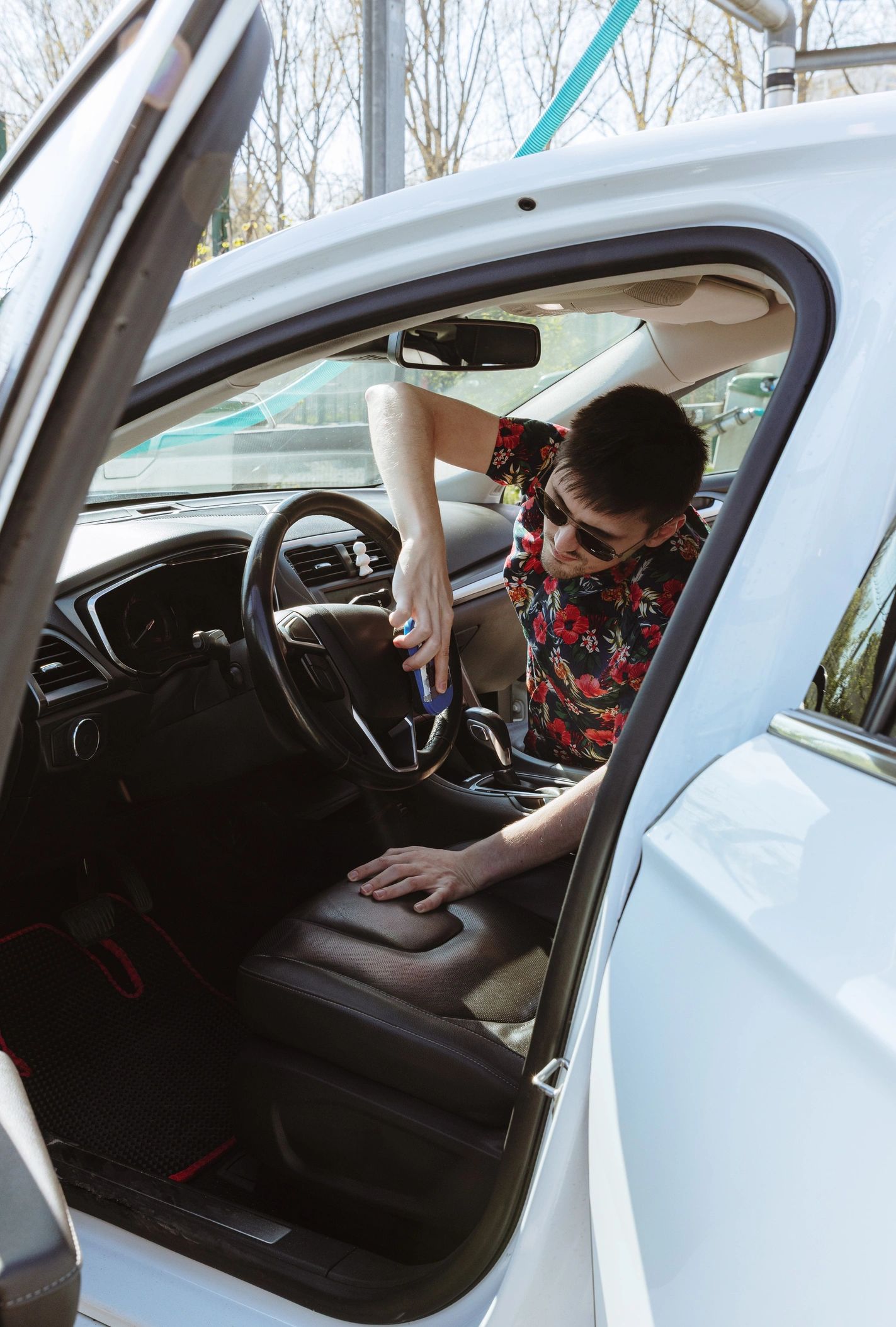 Detailing professional cleaning a vehicle interior